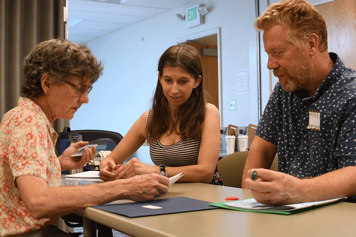 Three ATHENA participants test drive a game.