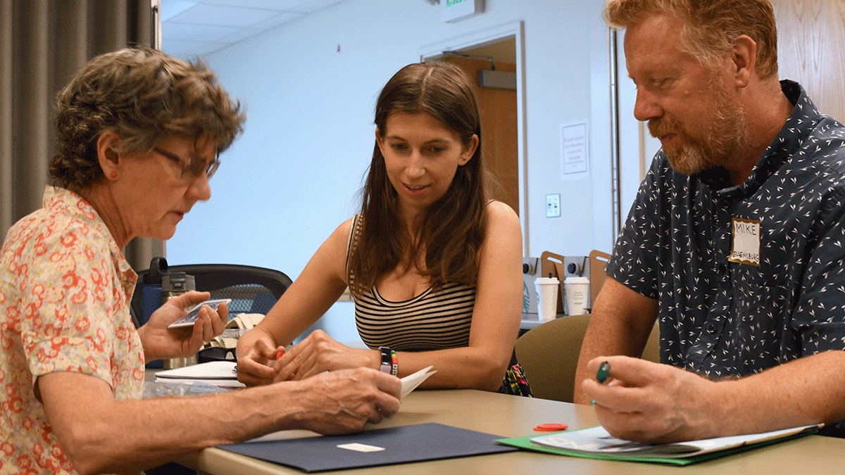 Three EDGE staff and teachers playing a game to teach about the health impacts of vaping