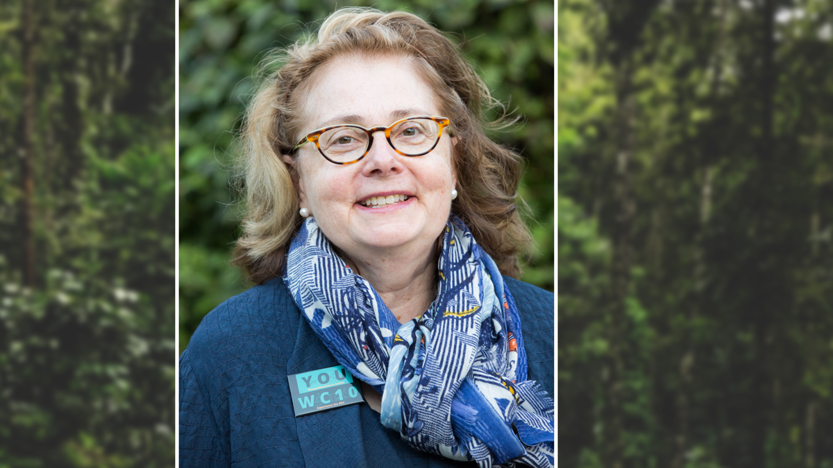 Portrait of Elaine Faustman with trees in the background