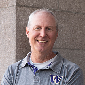 Older white man smiling at camera