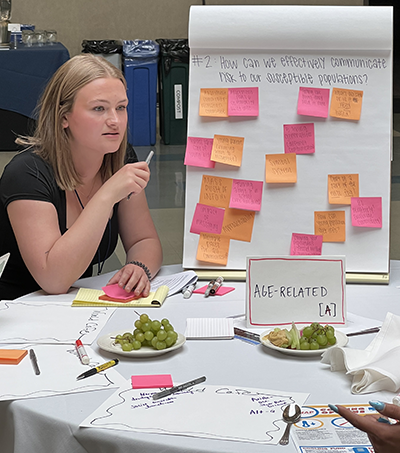 Student participating in a discussion at the meeting.