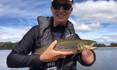 Gallagher holding a fish.