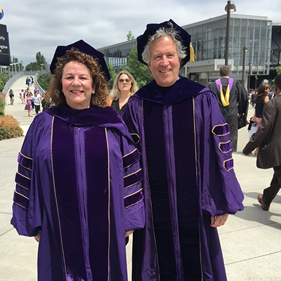 Kim and Tom in graduation gear