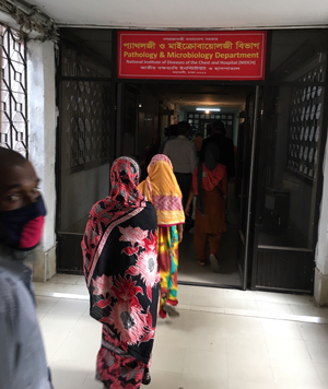 People wait in line for a TB clinic in Bangladesh.