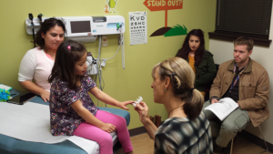 Dr. Karr performs a skin prick test. Photo by HAPI project