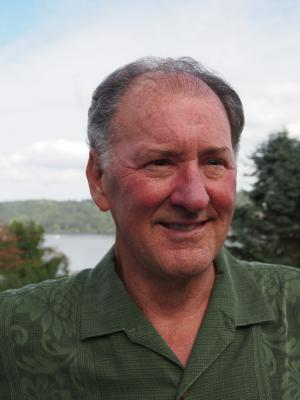 Headshot of James Meador, an older white man with gray hair