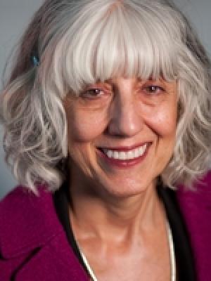 Headshot of Marguerite Pappaioanou, an older white woman with medium-length curly white hair and fringe