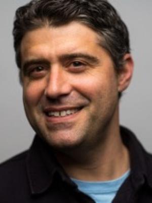 Dr Bratman, a smiling middle-aged white man with thick wavy brown hair