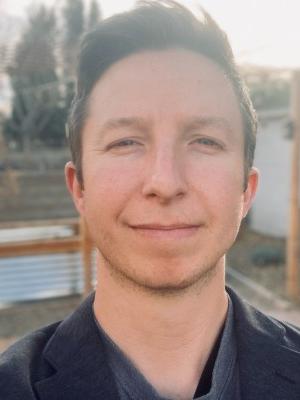 A young white man with fluffy brown hair