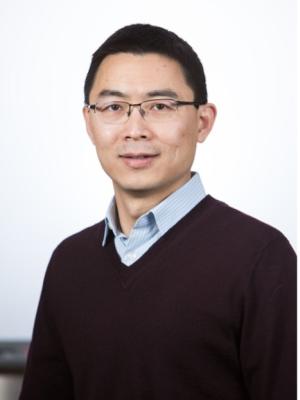 Dr Xu, a middle-aged Asian man with short hair and small glasses