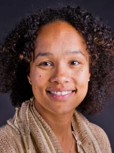 Dr Andrasik, a middle-aged black woman with shoulder-length curly hair