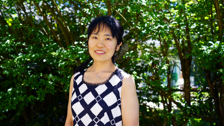 Portrait of Scyler Li with trees in the background