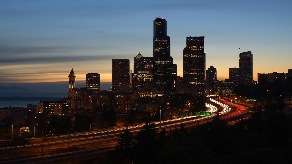 Traffic on a roadway at night in Seattle.