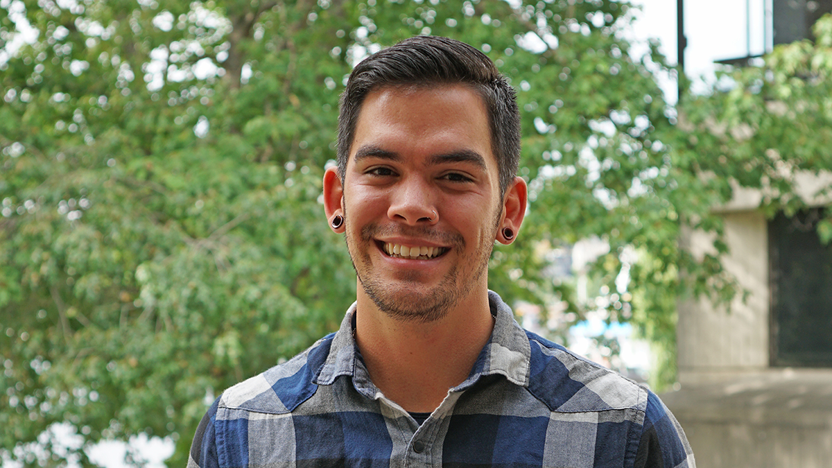 Headshot of man in plaid shirt