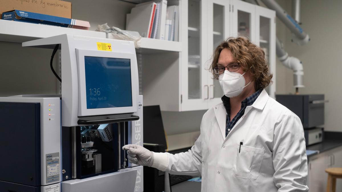 Luke placing a sample in a tool