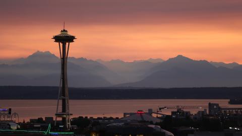 Smoky skies over the Seattle skyline looking west to Olympic Mountains.