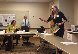 Patty Martin gestures with her hand while encouraging summit attendees to know their rights.